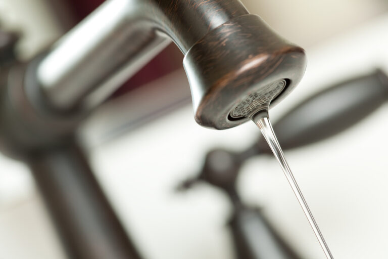 Close-up of Water Dripping from Water Faucet